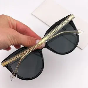 GUCCI グッチ　sunglasses キャッツアイ　GG0565S ブラック Gucci Oval Sunglasses GG0565S 001 Black/Clear/Gold 54mm 0565